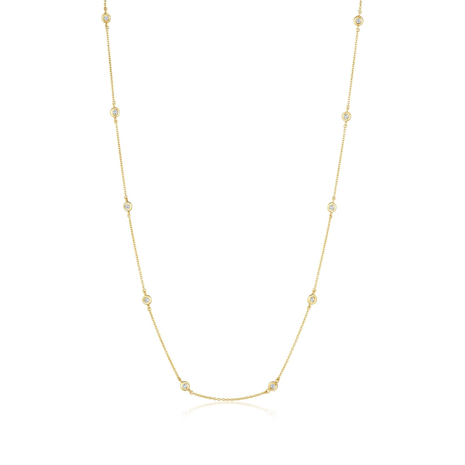 Gold necklace with small gems on a white background