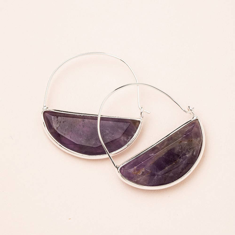 A pair of hoop earrings with a semi-circular amethyst stone set in a silver frame, displayed against a light background.