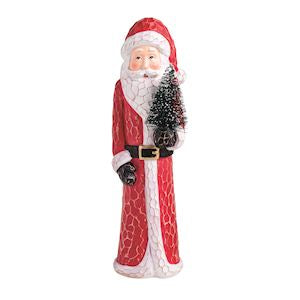 A Santa Claus figurine holding a small artificial Christmas tree, featuring a red and white textured coat, black belt, and black gloves, set against a plain white background.