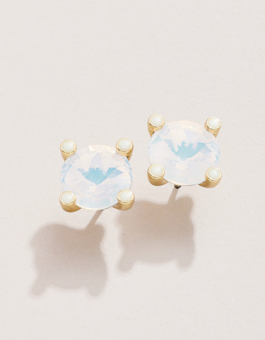 Pair of opal stud earrings on a light background