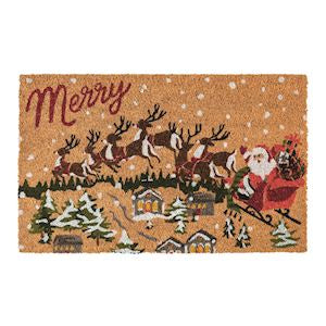 Christmas-themed doormat with Santa Claus, reindeer, and snowy village design on a white background.