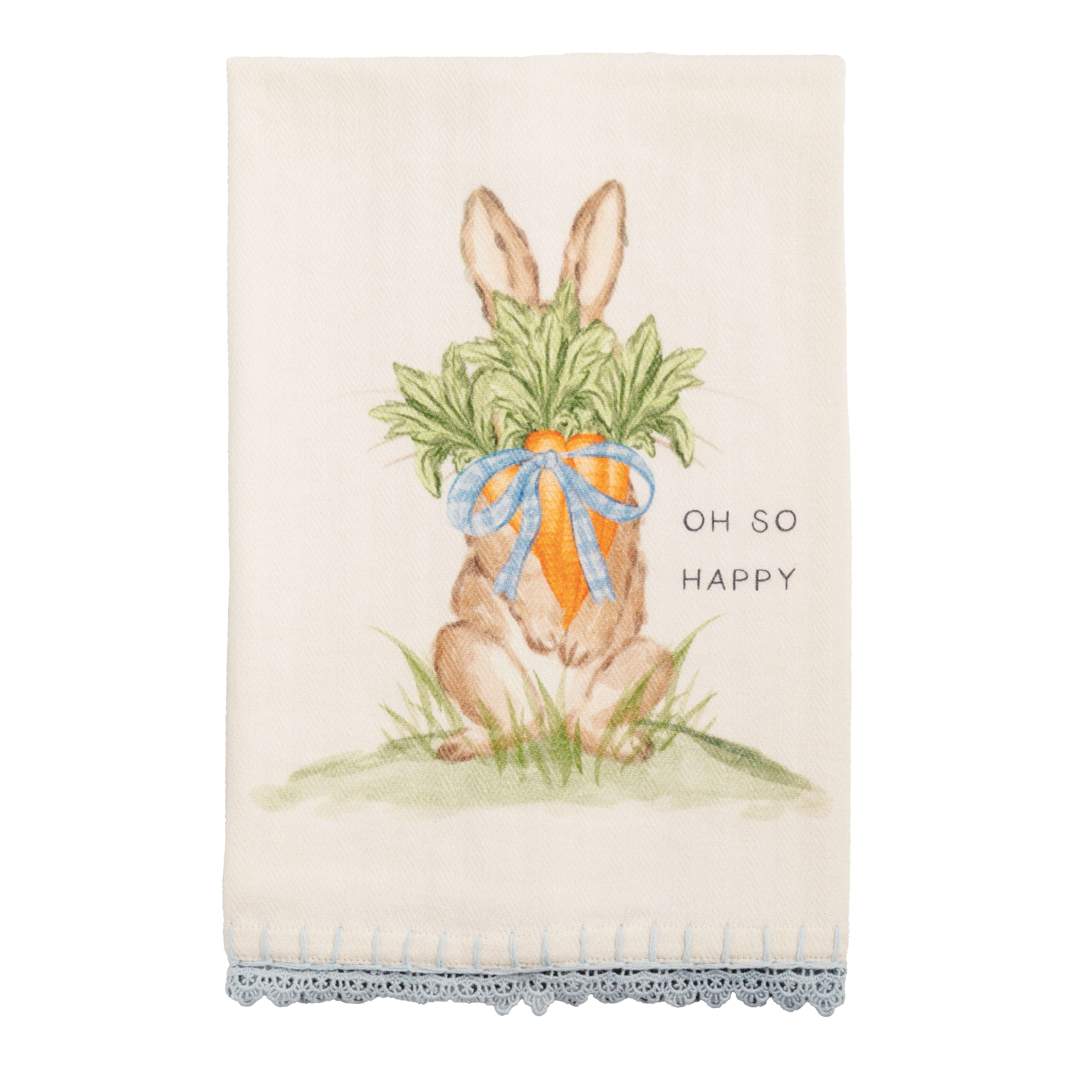 Decorative towel with a bunny holding carrots and 'Oh So Happy' text on a white background