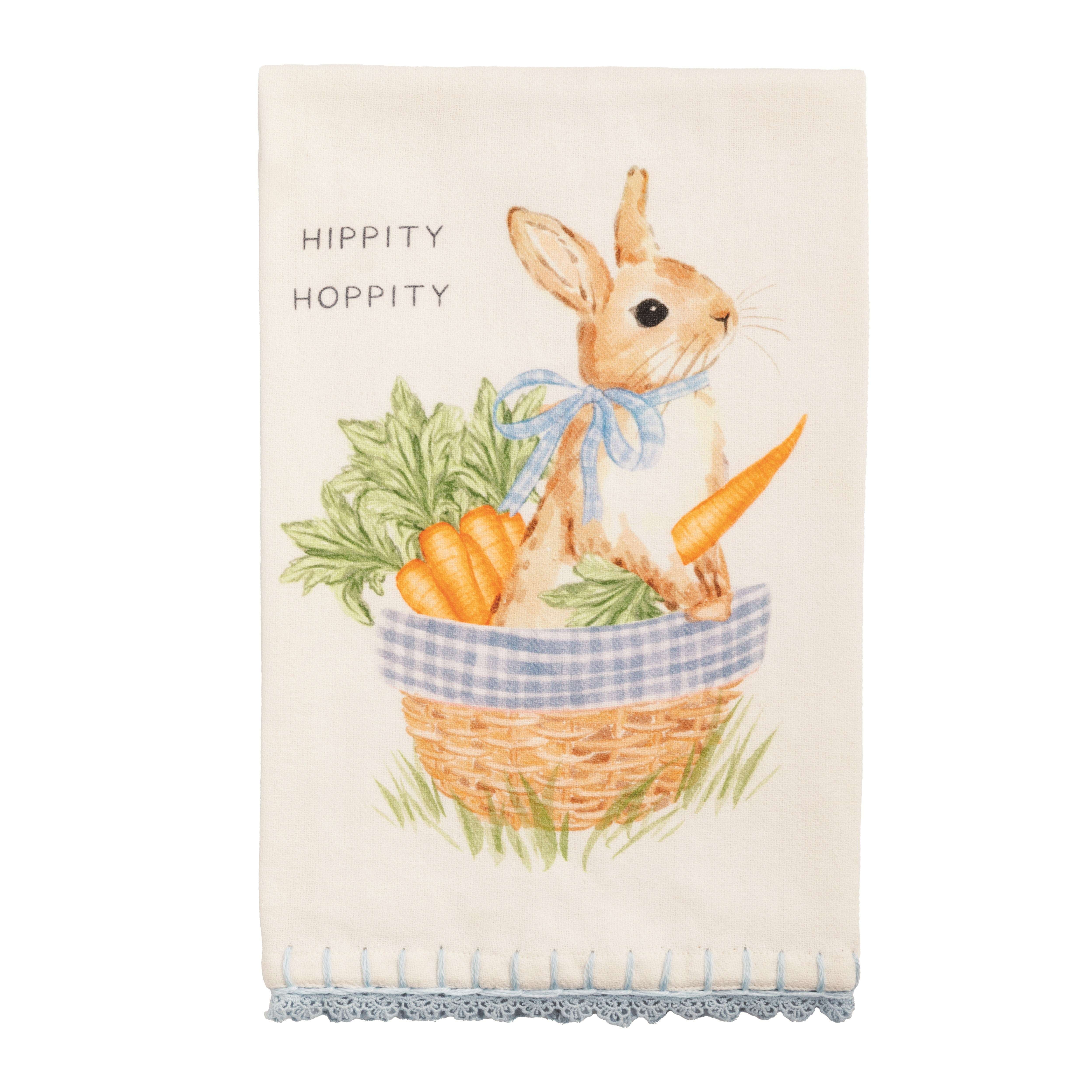 Tea towel with a bunny and carrots design and 'Hippity Hoppity' text.