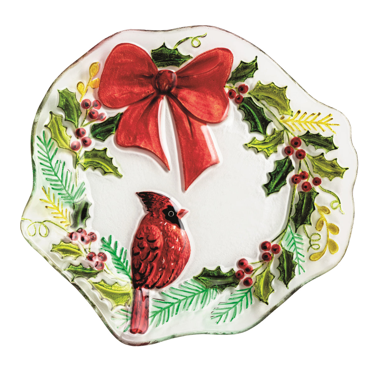Decorative plate with a red bow, cardinal, and holly design on a white background