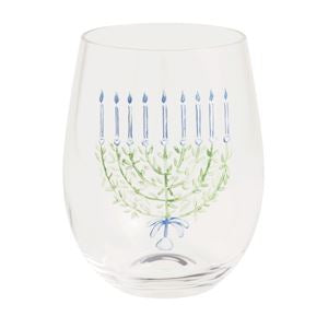 A clear stemless wine glass featuring a printed Hanukkah menorah design with green branches and blue candle details, shown against a plain white background.