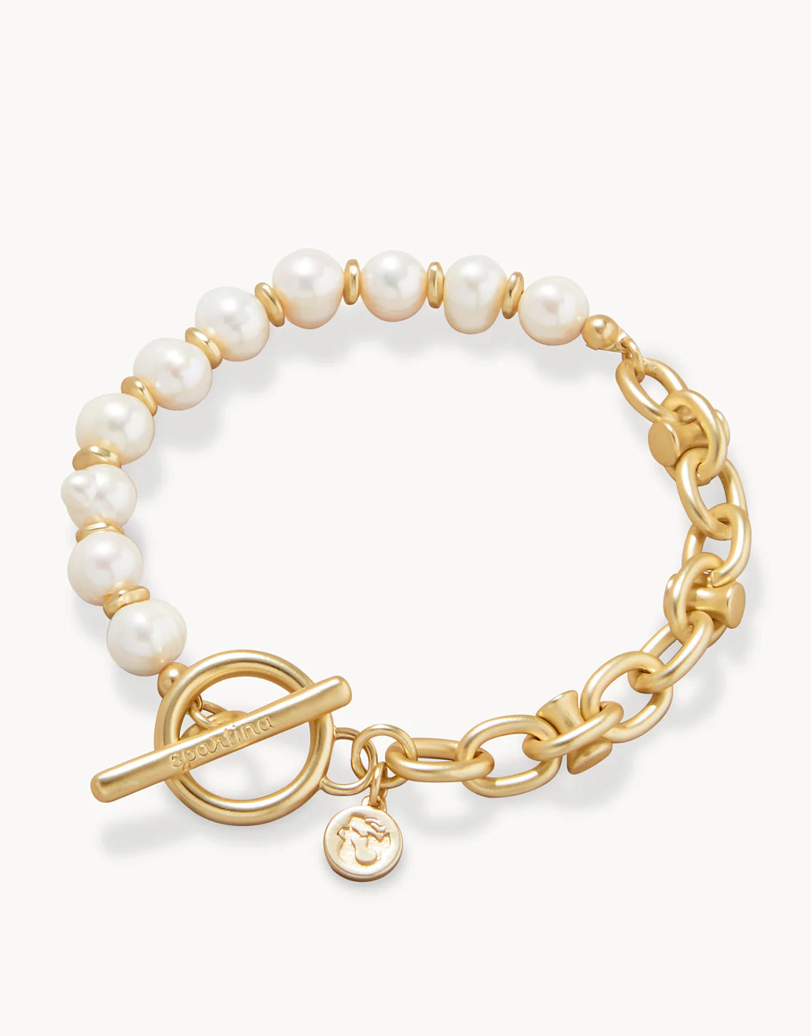 A gold-plated metal bracelet with freshwater pearls and a toggle closure.