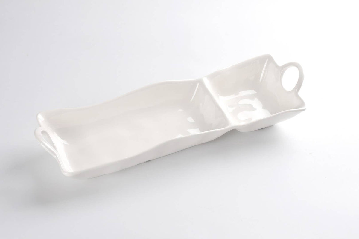 White ceramic tray with a handle on a light gray background