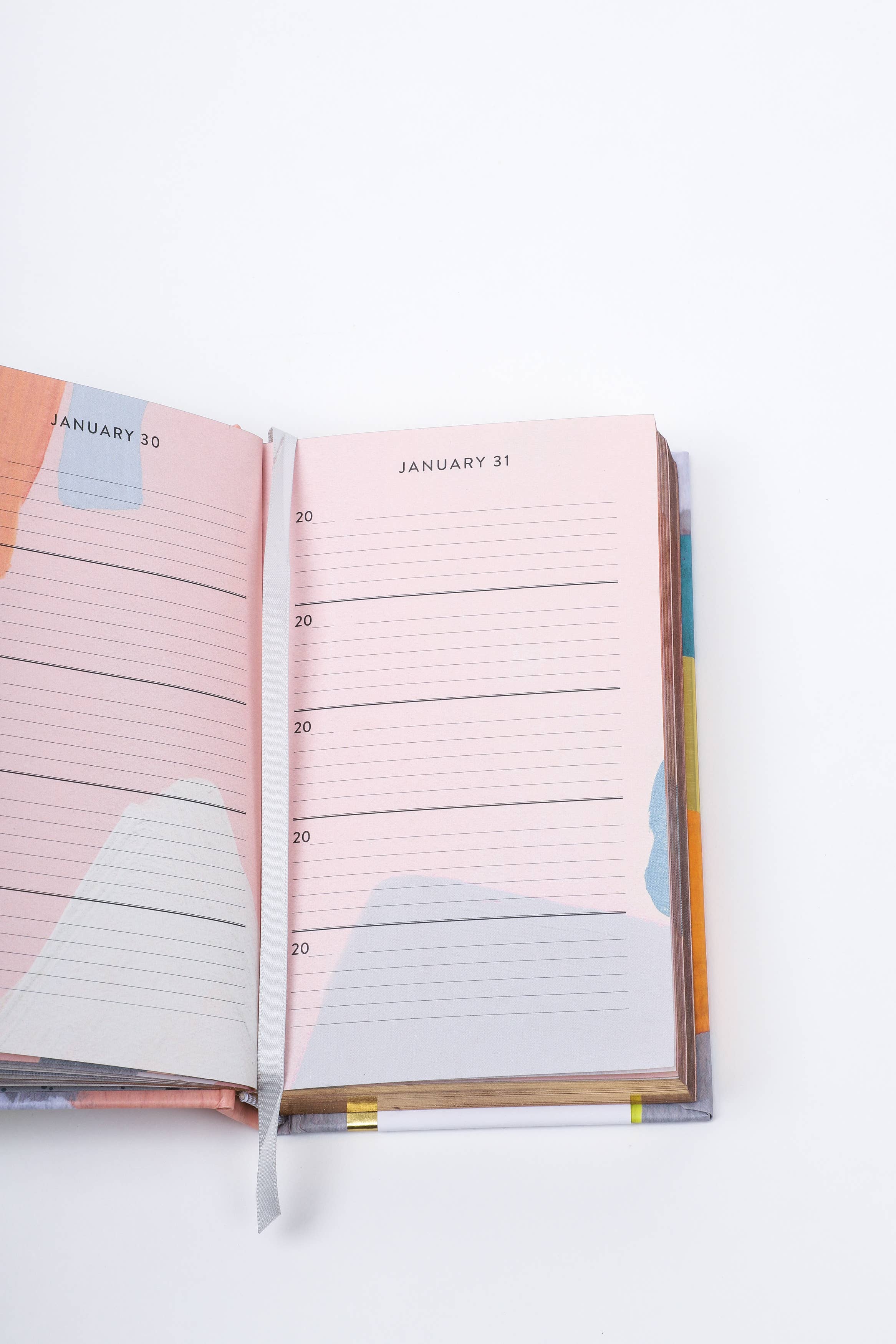 Open planner with colorful design on a white background