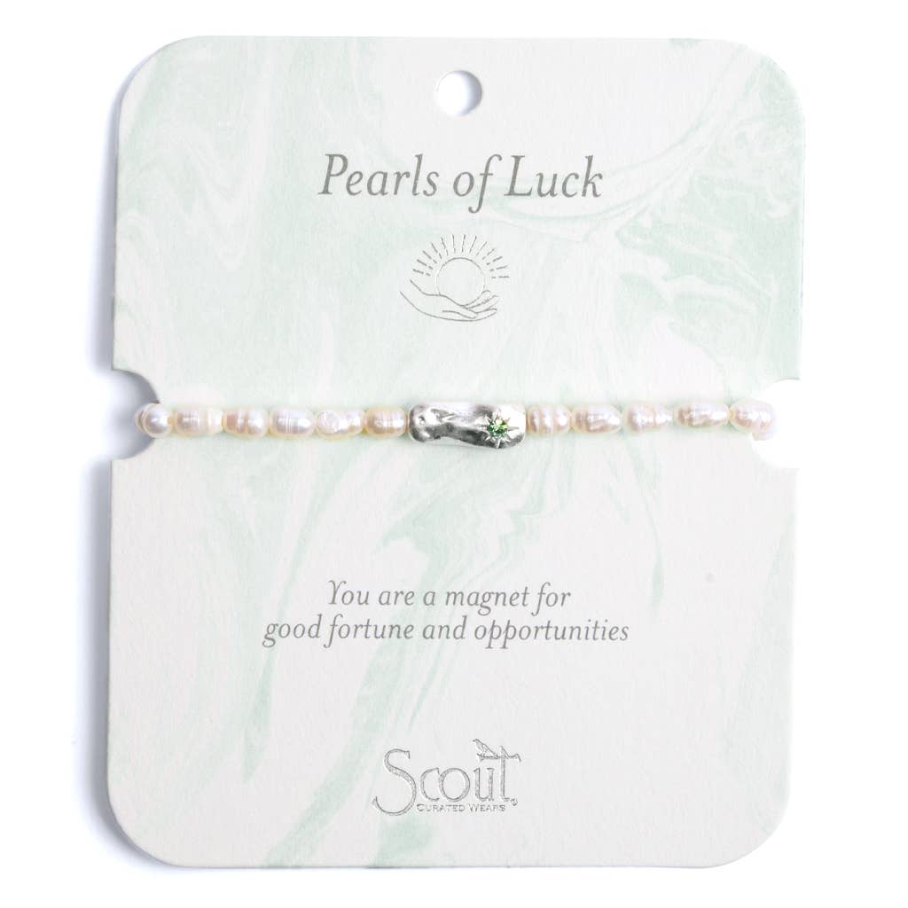 A bracelet with a mix of pearl and crystal beads on a card with 'Pearls of Luck' text and a space for a personalized message.