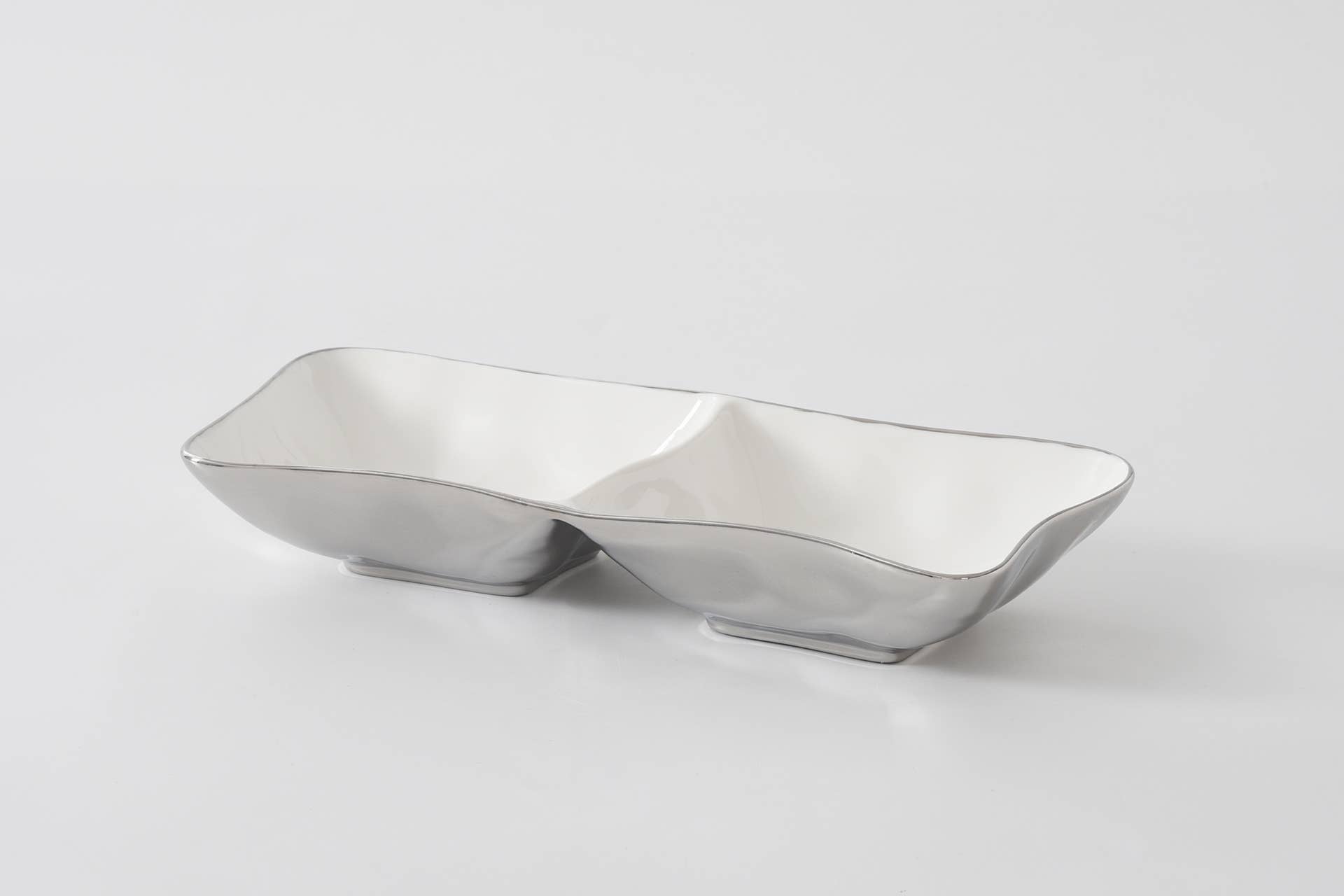 Silver bowl with a unique design on a white background