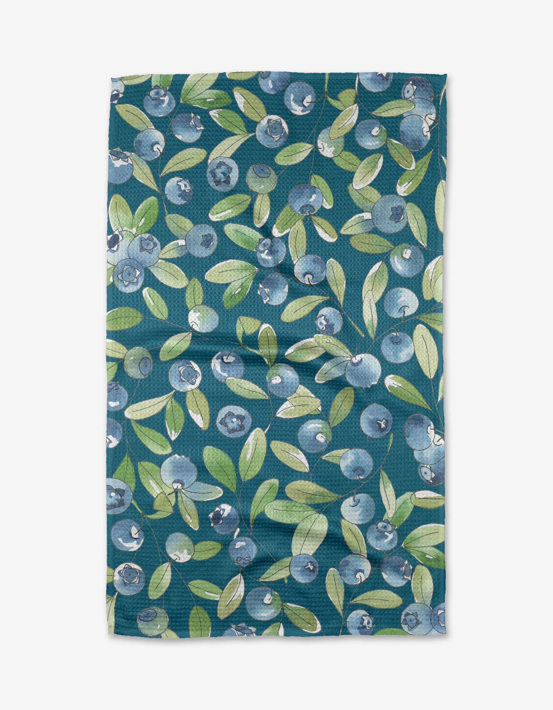 A tea towel with a blueberry print on a dark green background, featuring a waffle weave construction.