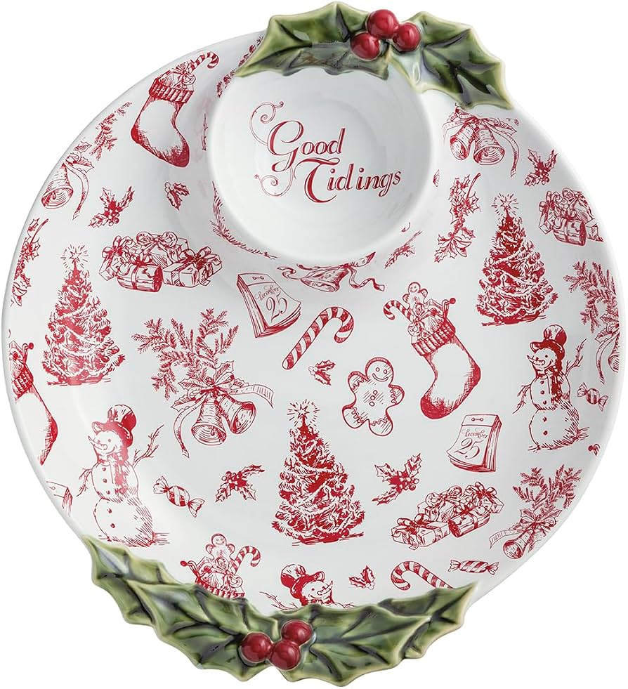 white and red decorative bowl with holly handles against a white background