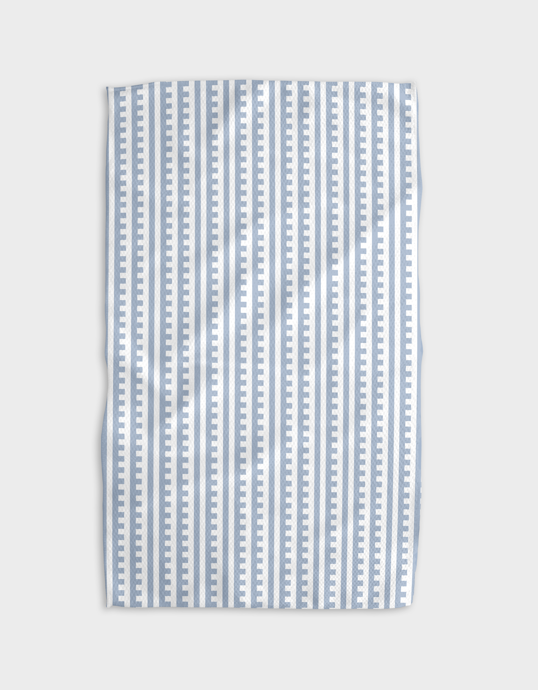 A blue and white striped tea towel with a solid pattern and a hang loop.