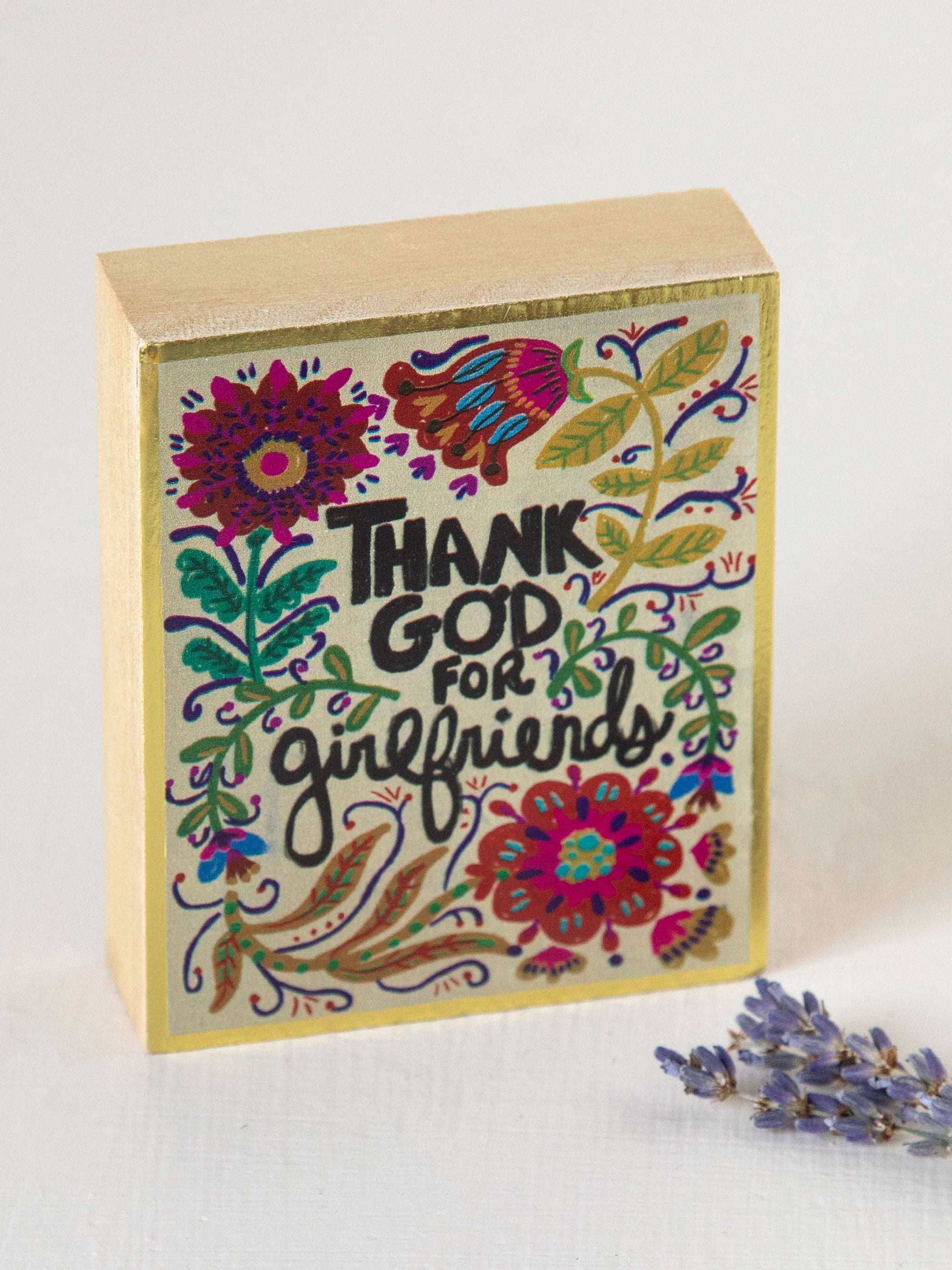 Decorative box with floral design and 'Thank God for Girlfriends' text on a white background