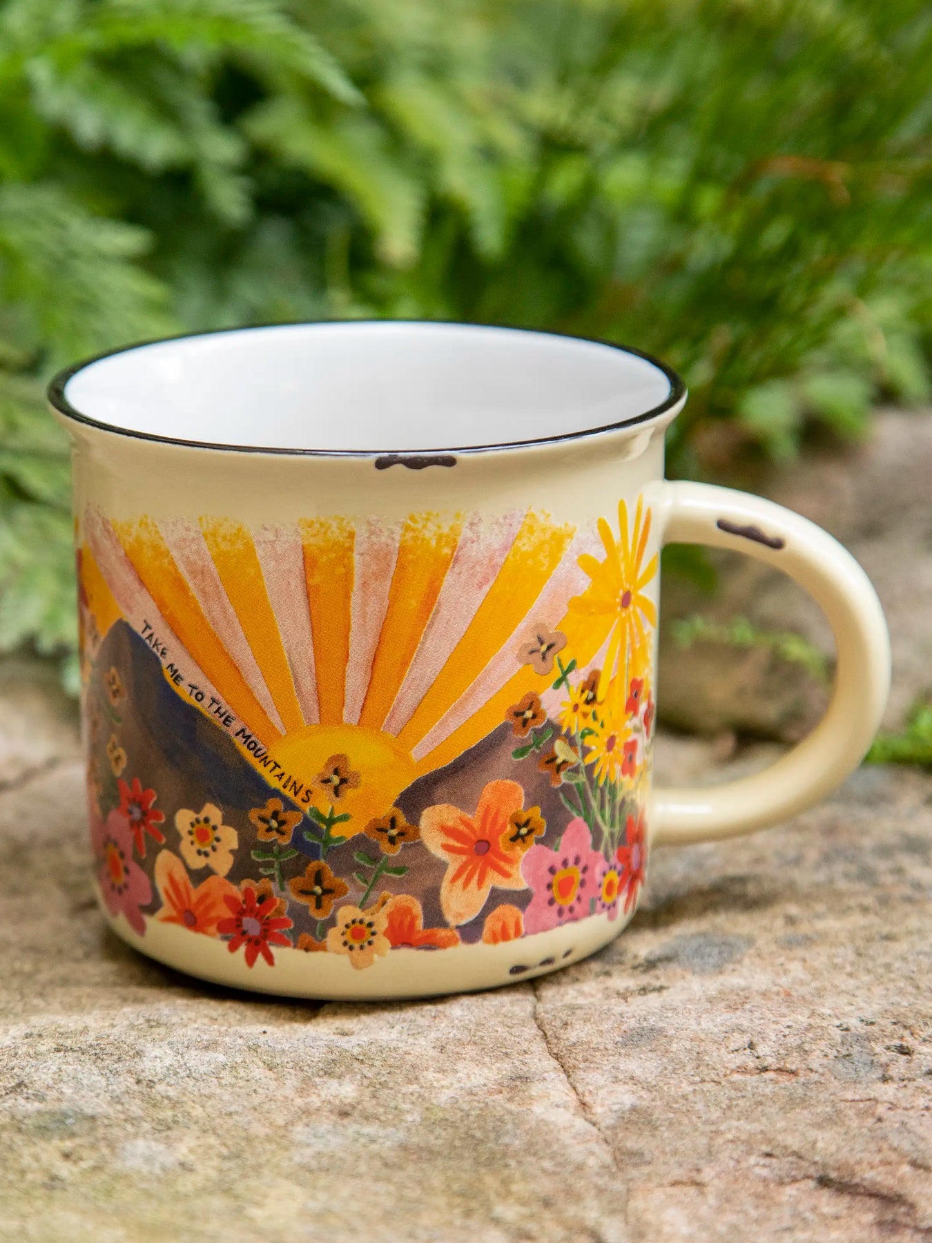 Mug with floral and sun design on a natural background