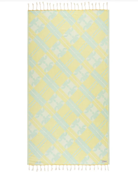 A yellow and blue plaid towel with twisted tassels on a white background