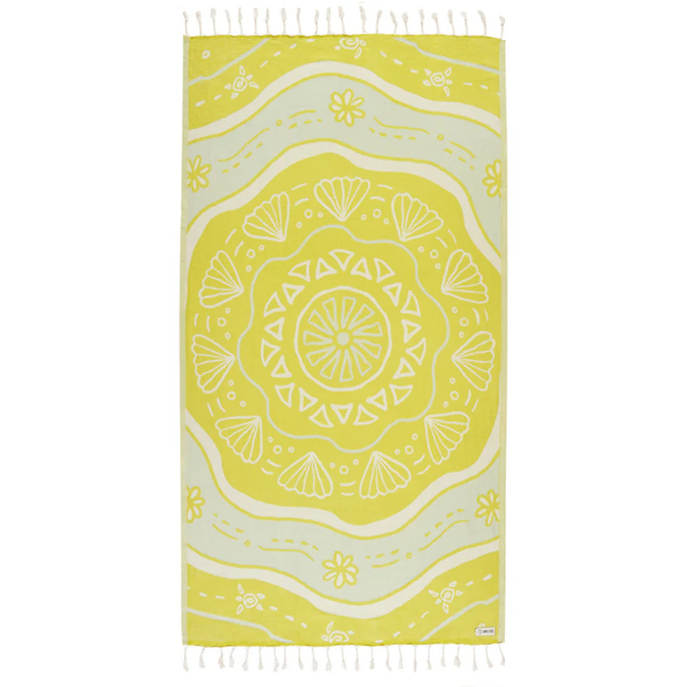 Yellow and white patterned towel with fringes on a white background