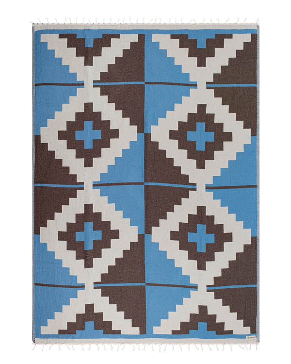 blanket with geometric pattern on a white background