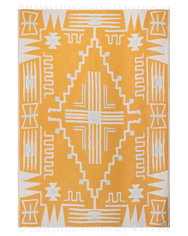 Yellow and white patterned towel with geometric design