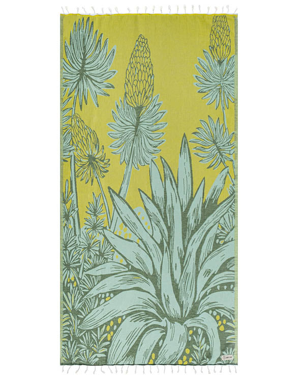 beach towel towel with green floral
 design on a yellow background