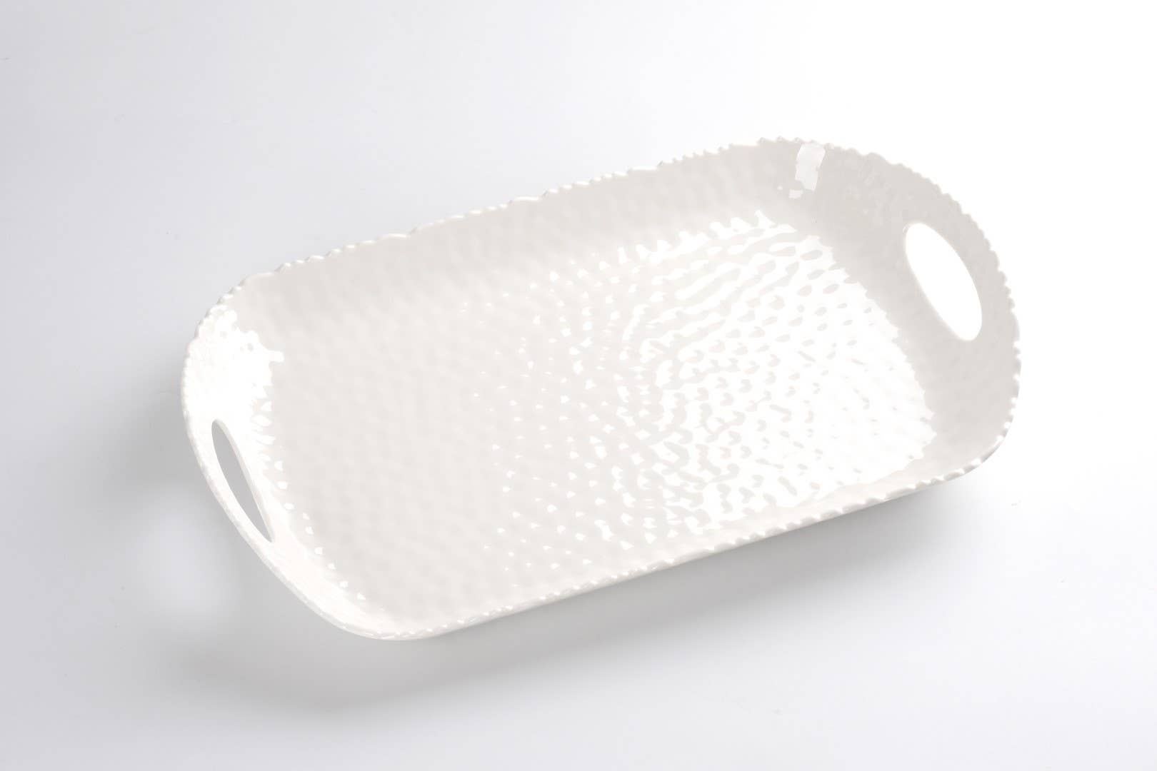 White textured rectangular tray on a light gray background