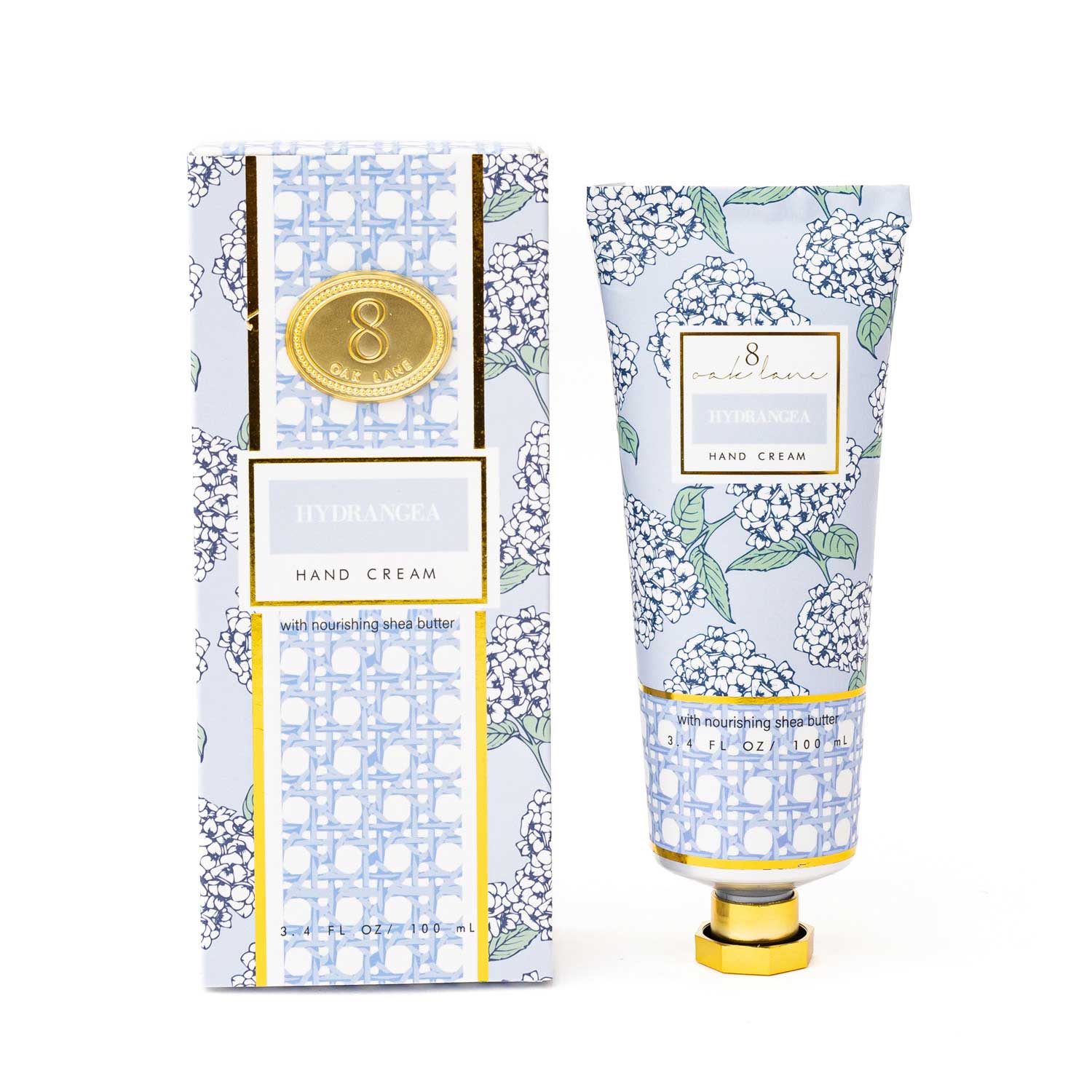 Hand cream with packaging featuring floral design and brand logo on a white background