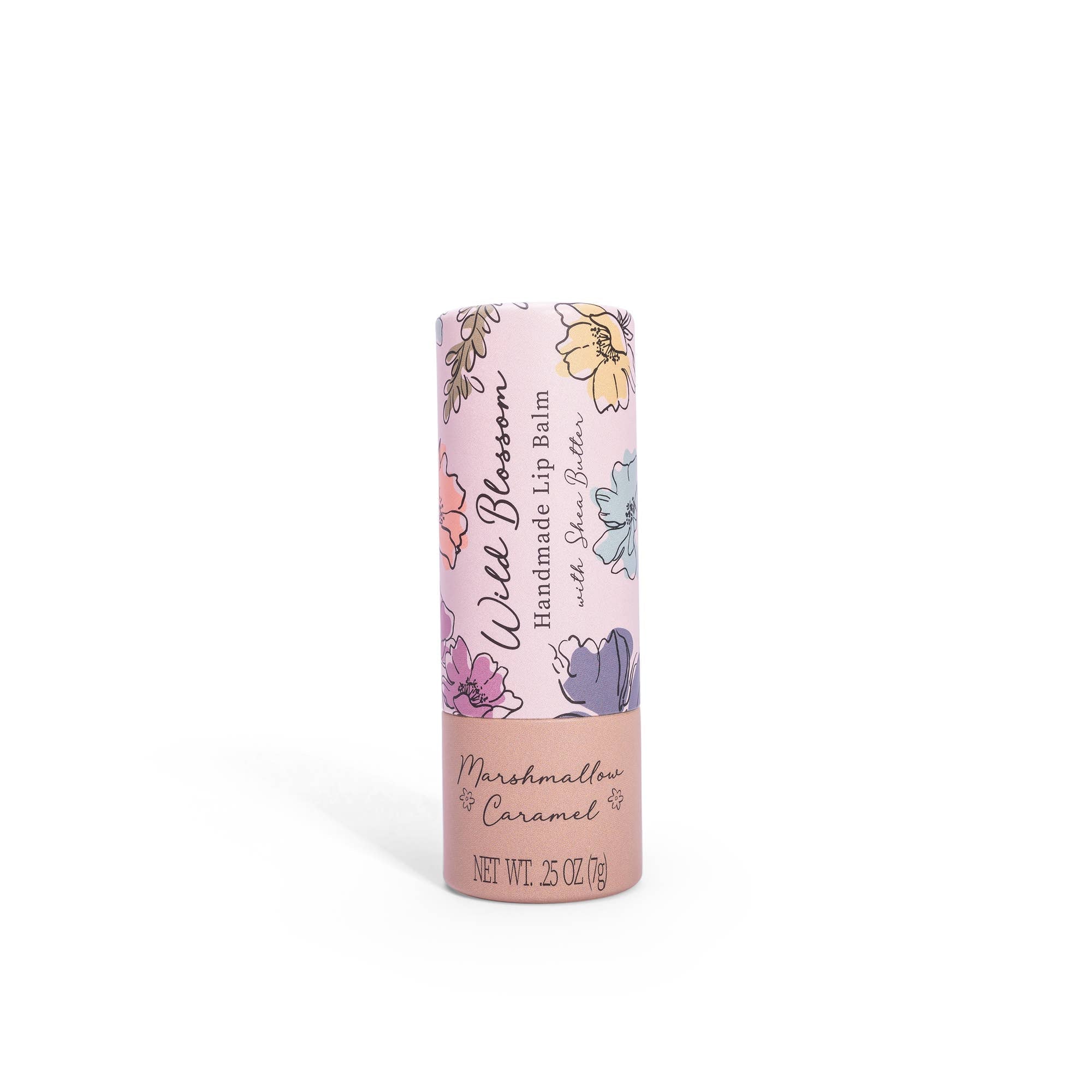 A cylindrical tube of Wild Blossom Lip Balm with Marshmallow Caramel flavor, featuring floral patterns and the brand name.