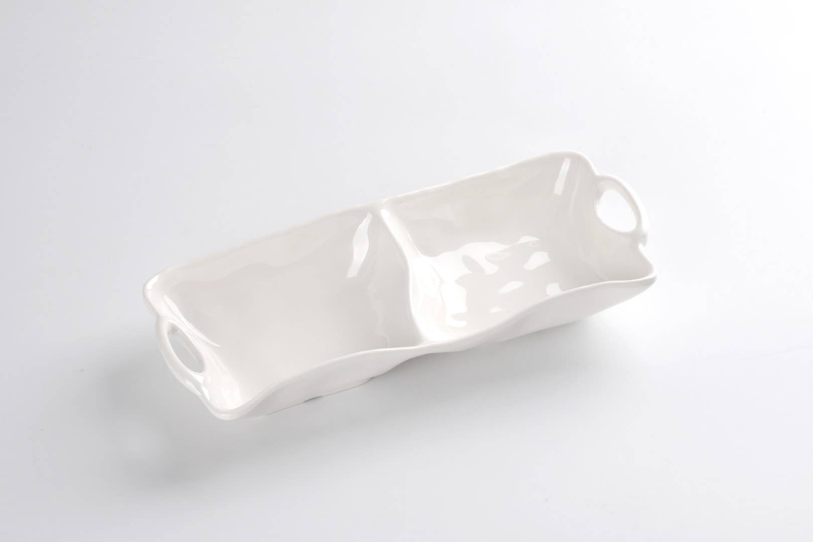 White melamine serving dish on a light gray background