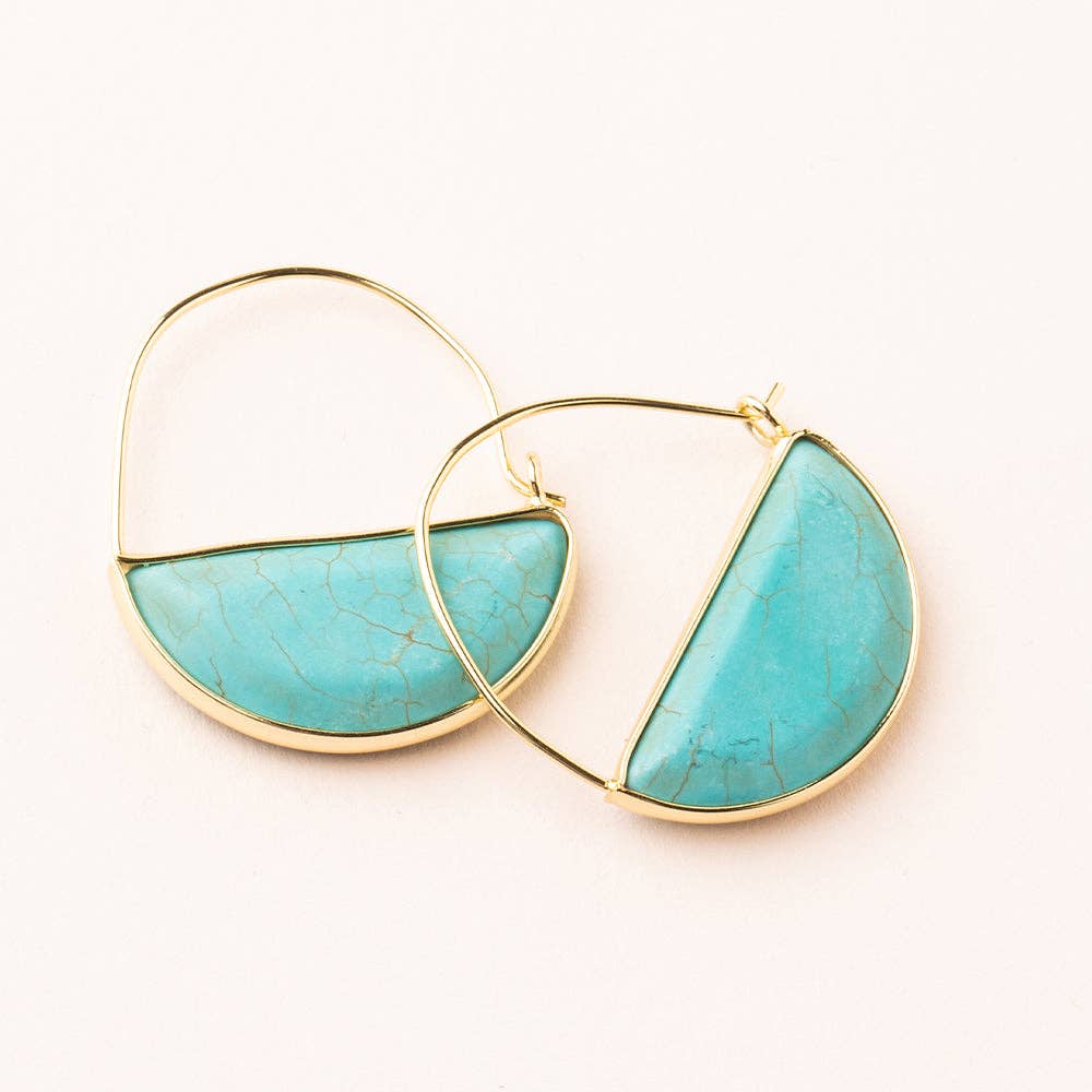A pair of hoop earrings with turquoise semi-circular stones set in gold-colored frames.