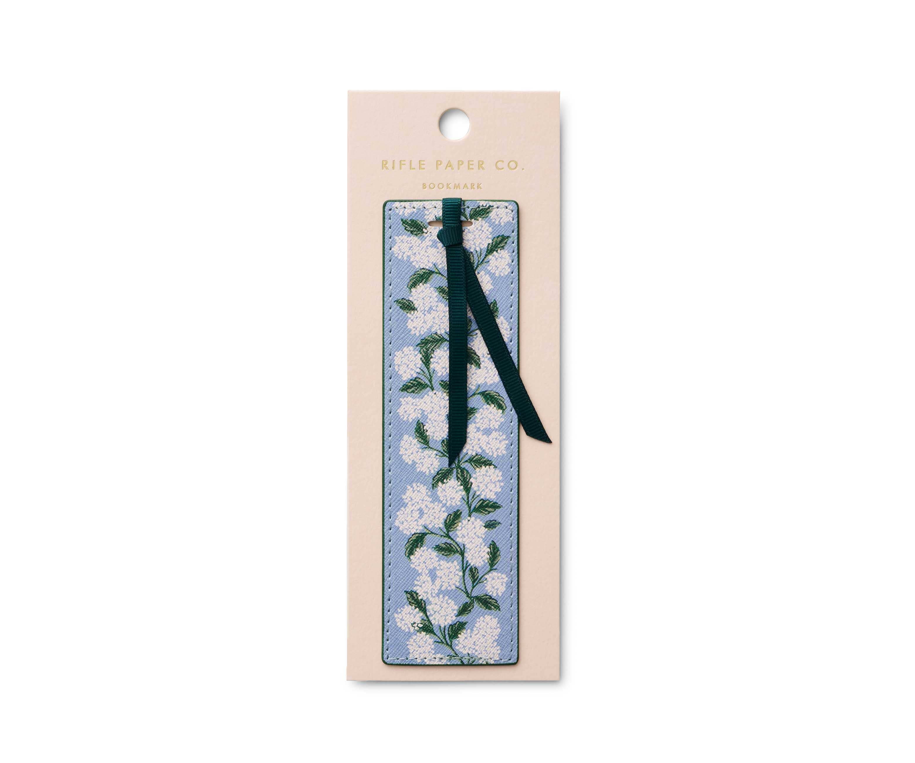 Floral bookmark with a black ribbon on a Kule Paper Co. branded card.