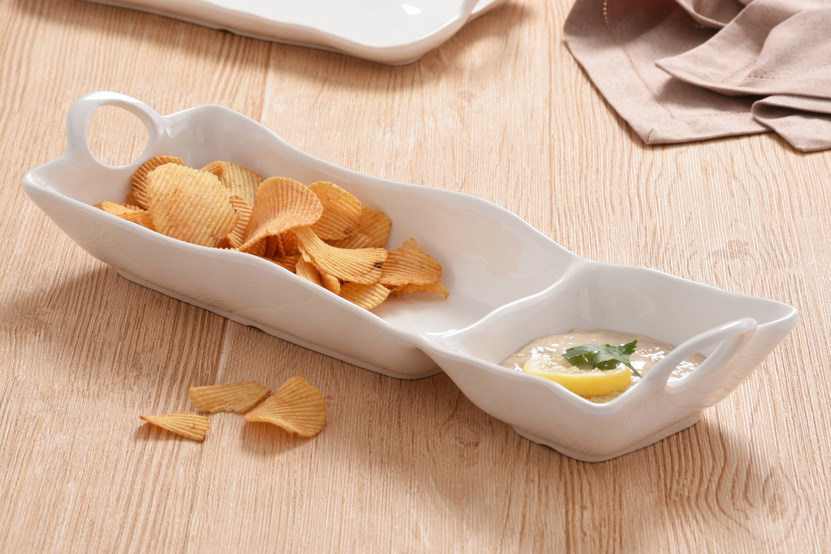 White ceramic dish with chips and dip on a wooden surface