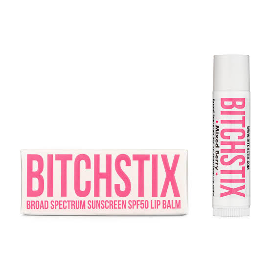 Missed Bitch Stix SPF 50 lip balm shown as a white tube with pink lettering next to its white and pink packaging box on a plain white background.