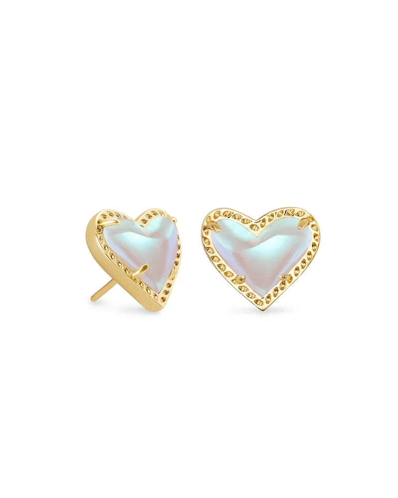 Heart-shaped earrings with gold frame and light-colored heart center on a white background