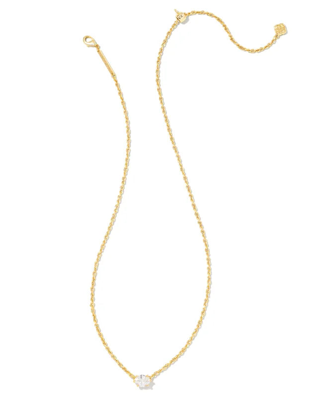 Gold necklace with a clear pendant on a white background