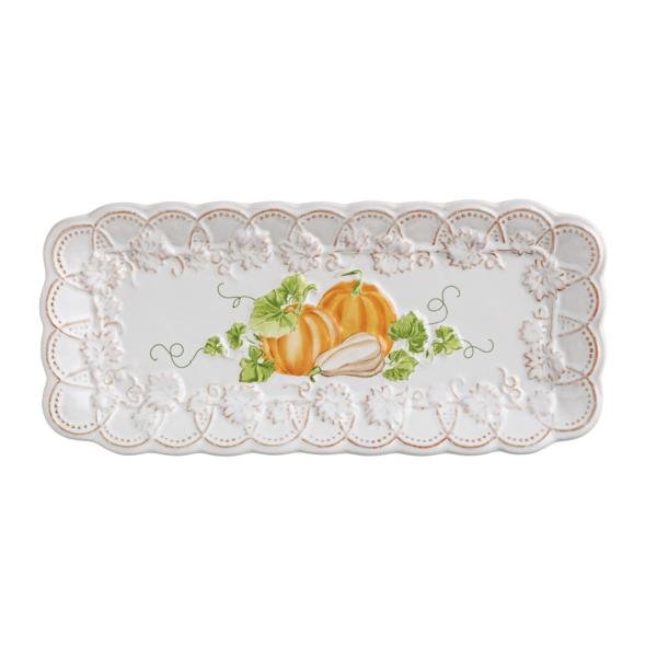 Decorative plate with pumpkins and lace design on a white background