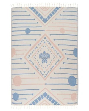 A large beach towel with a diamond and turtle pattern in blue and pink colors, featuring twisted tassels on the edges.