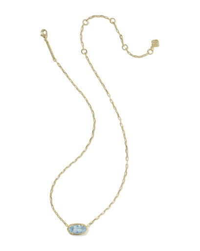 Gold necklace with a blue gemstone pendant on a white background