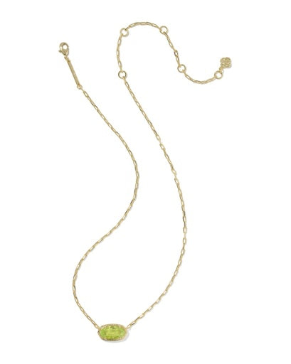 Gold necklace with a green pendant on a white background