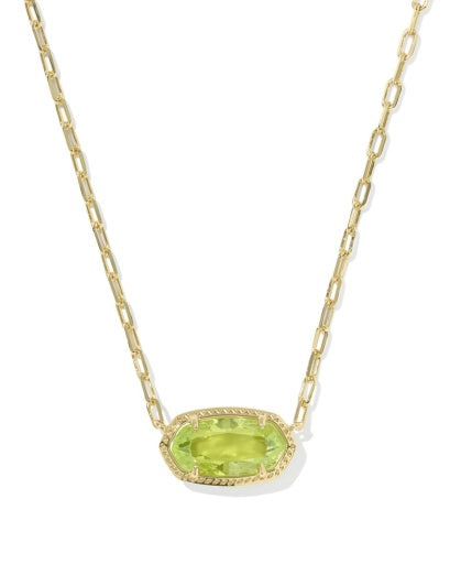 Gold necklace with a green gemstone pendant on a white background
