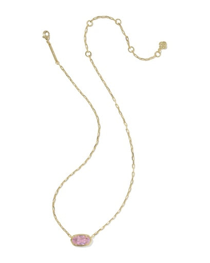 Gold necklace with a pink pendant on a white background