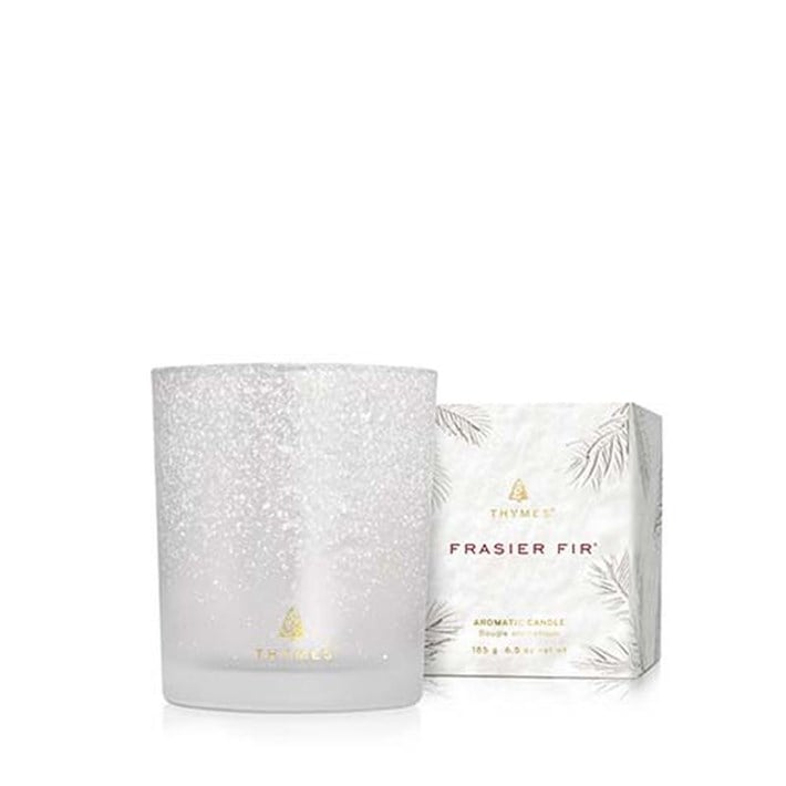 Thymes Frasier Fir candle and packaging on a white background