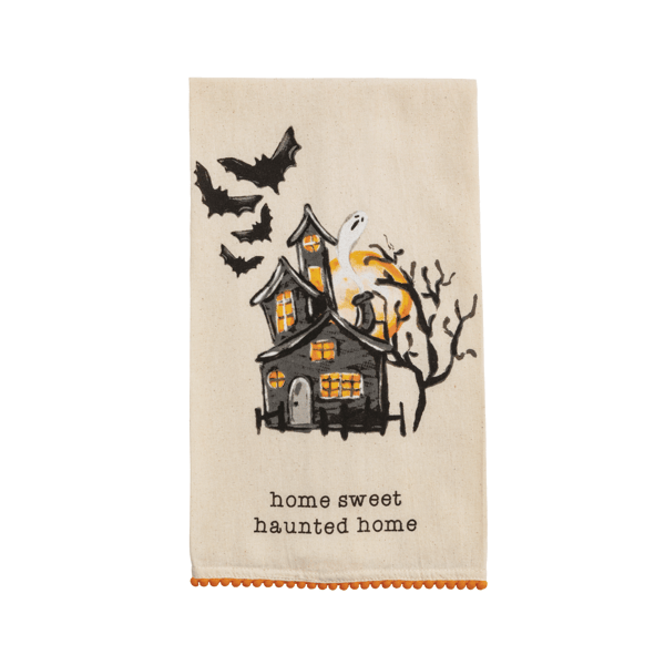 towel with haunted house and bats against a white background