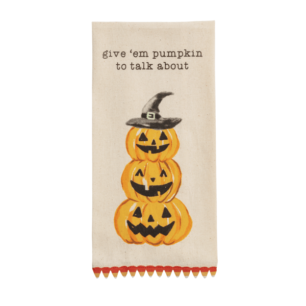 towel with three jack o lanterns and "give 'em pumpkin to talk about" against a white background