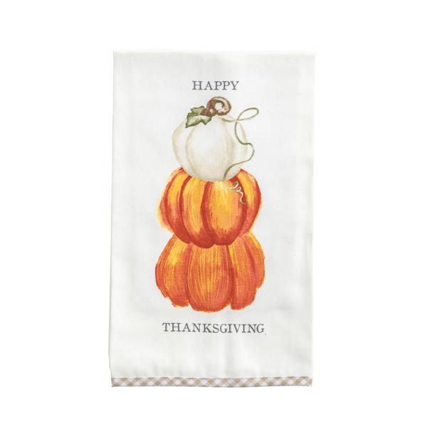 An off-white fabric tea towel featuring a stacked illustration of three pumpkins in shades of orange and white, with the words 'HAPPY THANKSGIVING' printed in black. The towel has a subtle gingham pattern along the bottom hem.