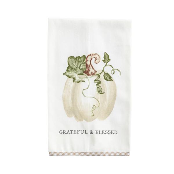 A white kitchen tea towel featuring a watercolor-style illustration of a white pumpkin with green leaves and vines, above the text 'GRATEFUL & BLESSED'. The towel has a decorative beige and white checkered border at the bottom.
