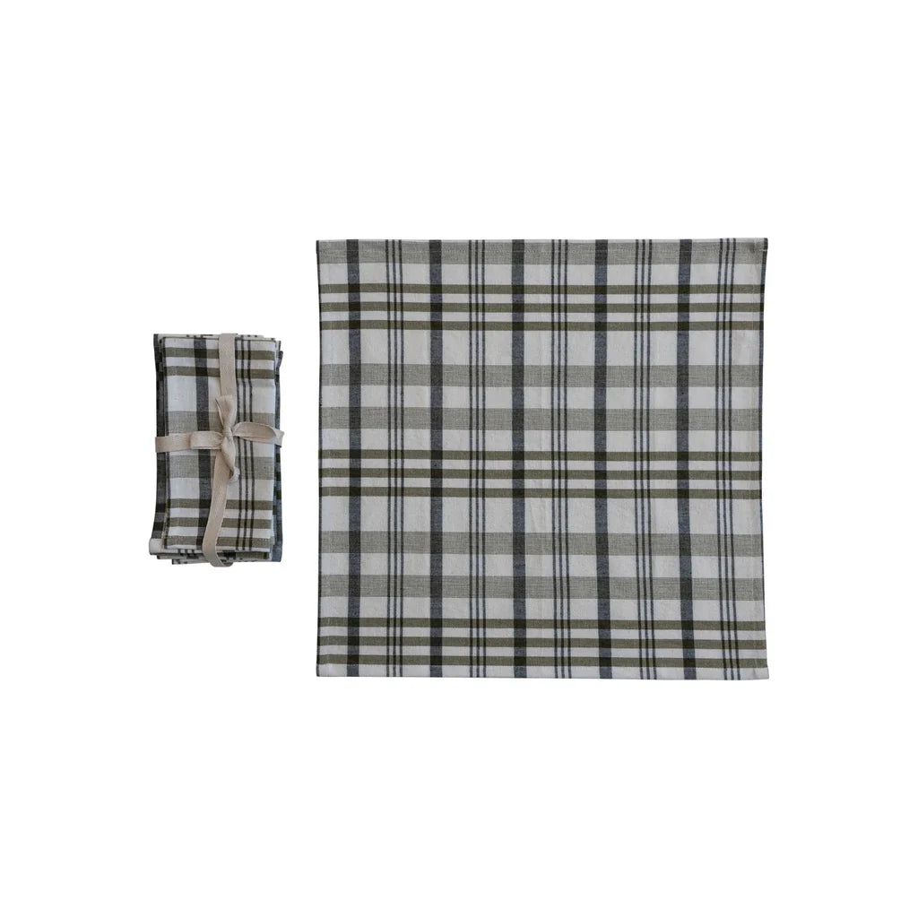 Plaid patterned blanket and small pouch on a white background